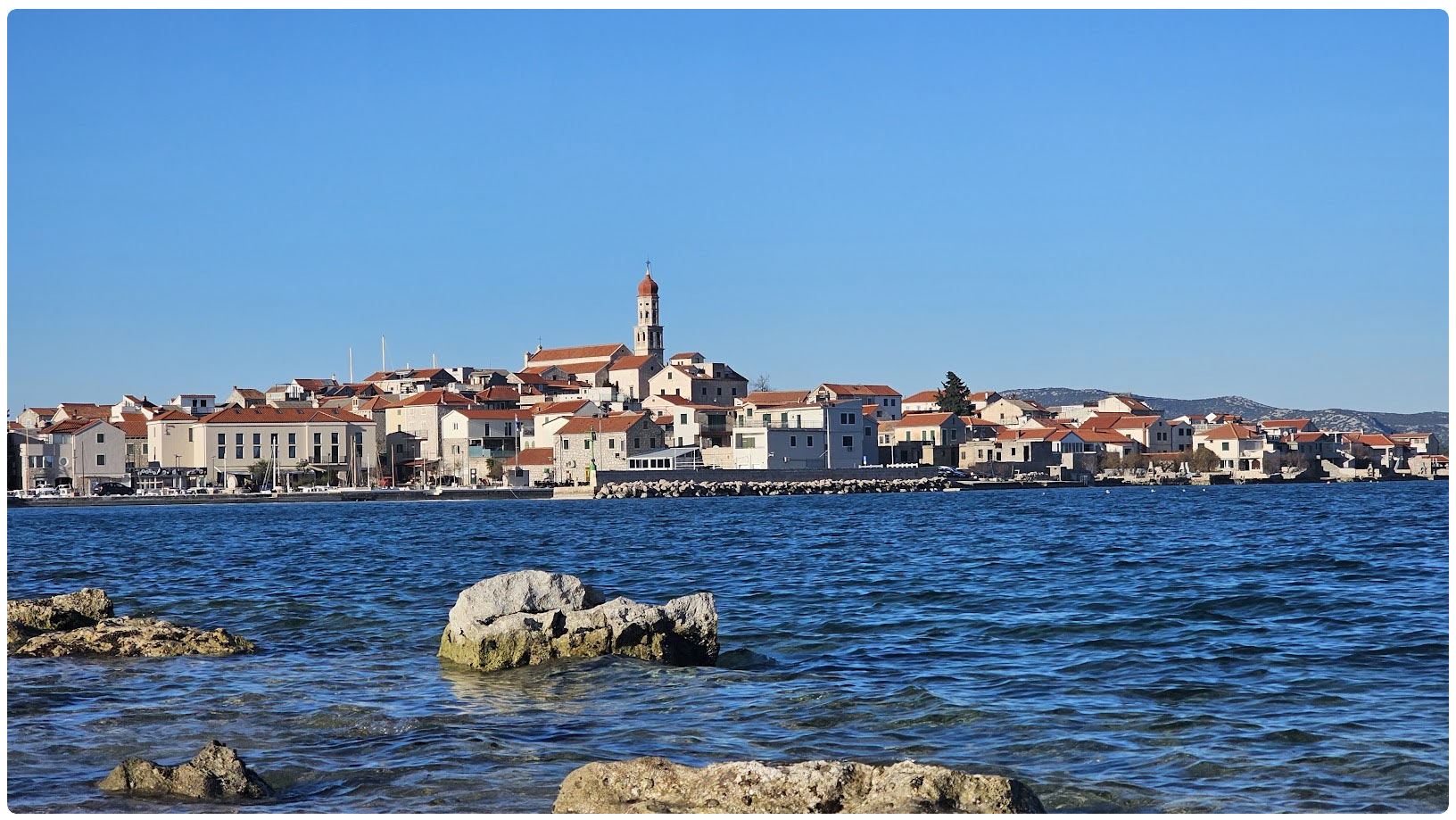 A view of Betina on island Murter in Croatia from a nearby beach.